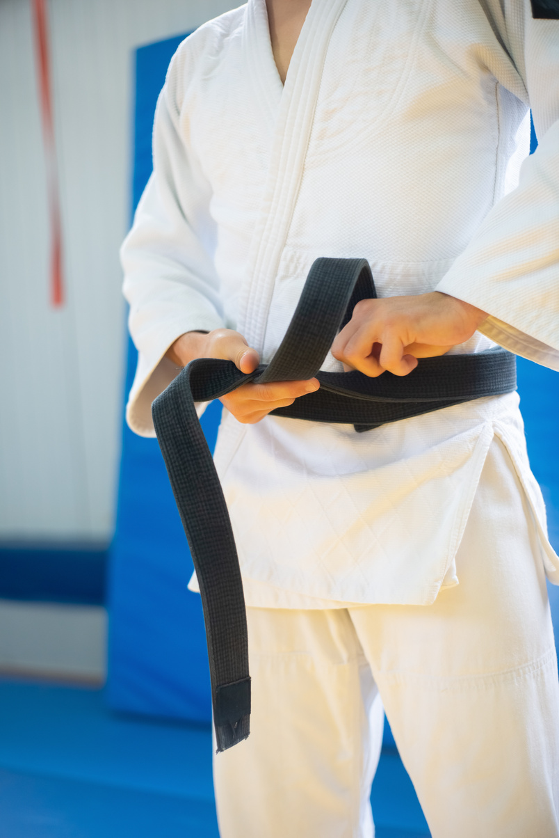 Person Wearing a Judo Uniform with a Black Belt